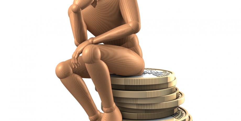http://www.dreamstime.com/stock-photo-thinker-man-resting-pile-coins-thinking-image31918890